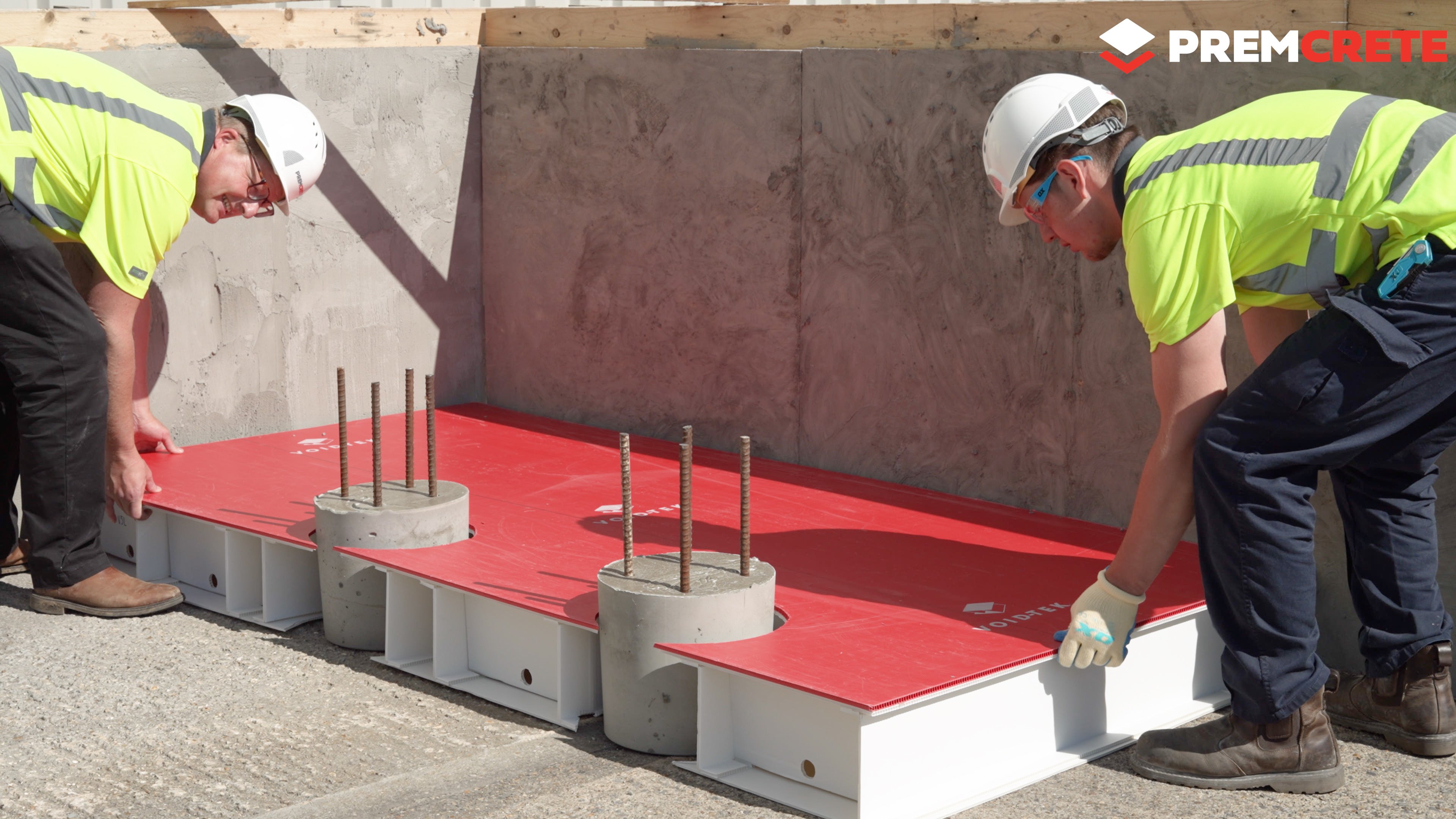 Premcrete engineers installing VOID-TEK ground heave protection system on a construction site, demonstrating sustainable and efficient void former application.